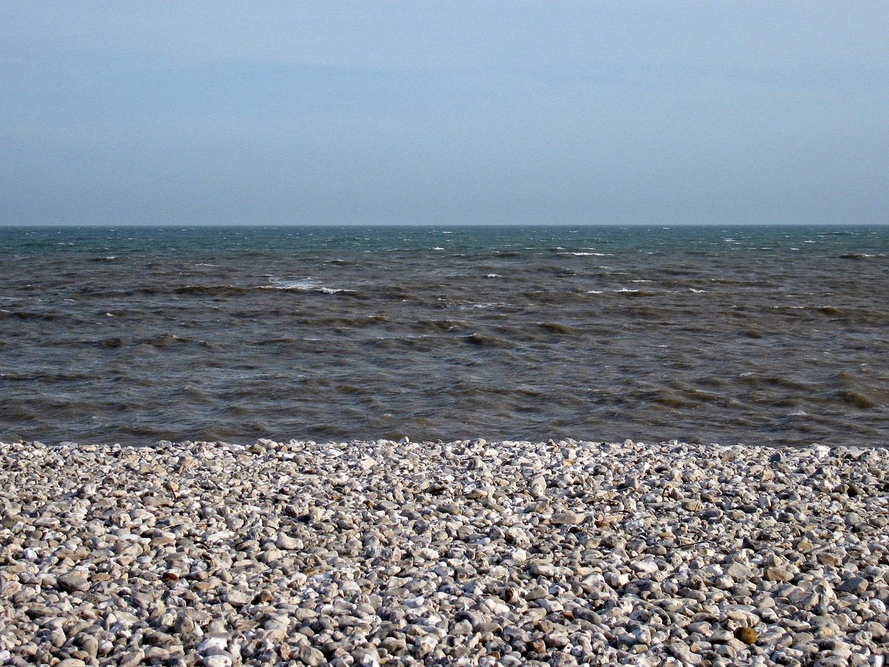 beach shore pebbles free photo