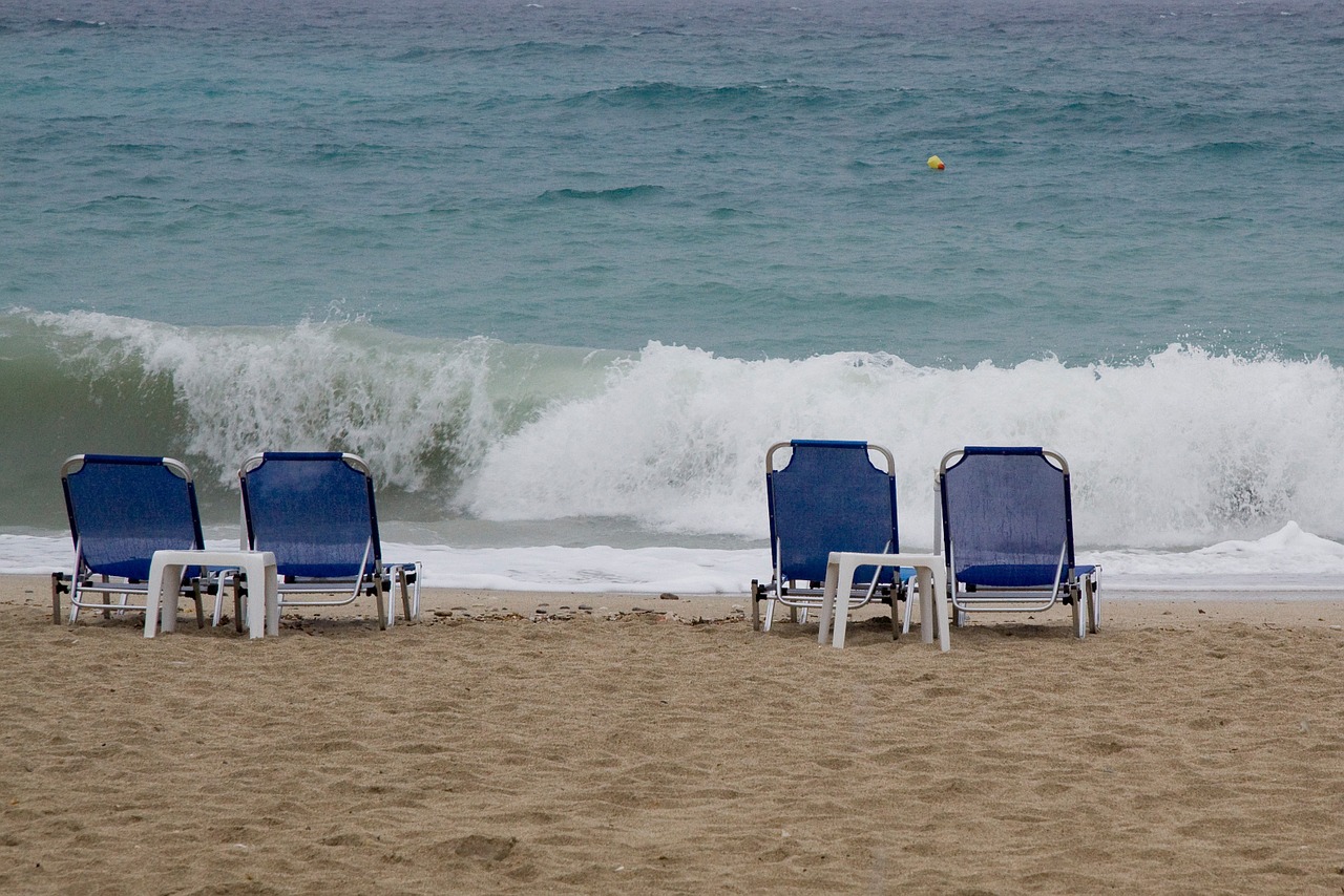 beach sun lounges waves free photo