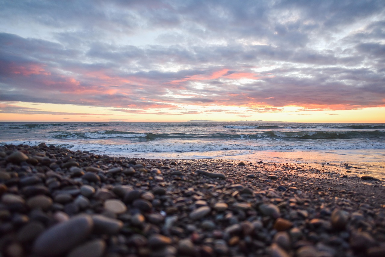 beach sunset pebbles free photo