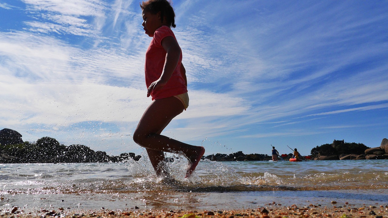 beach child foot in the water free photo