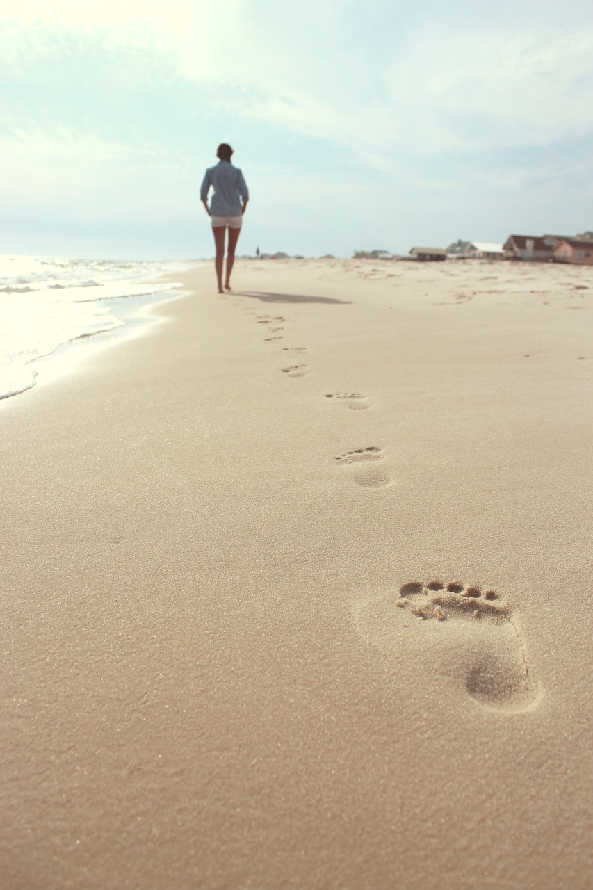 beach woman footprints free photo