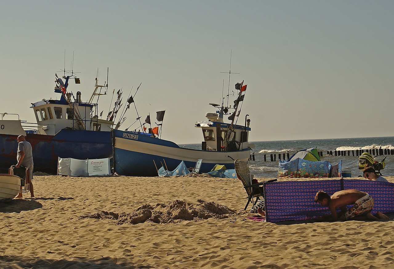 beach fishing boats boats on the sand free photo