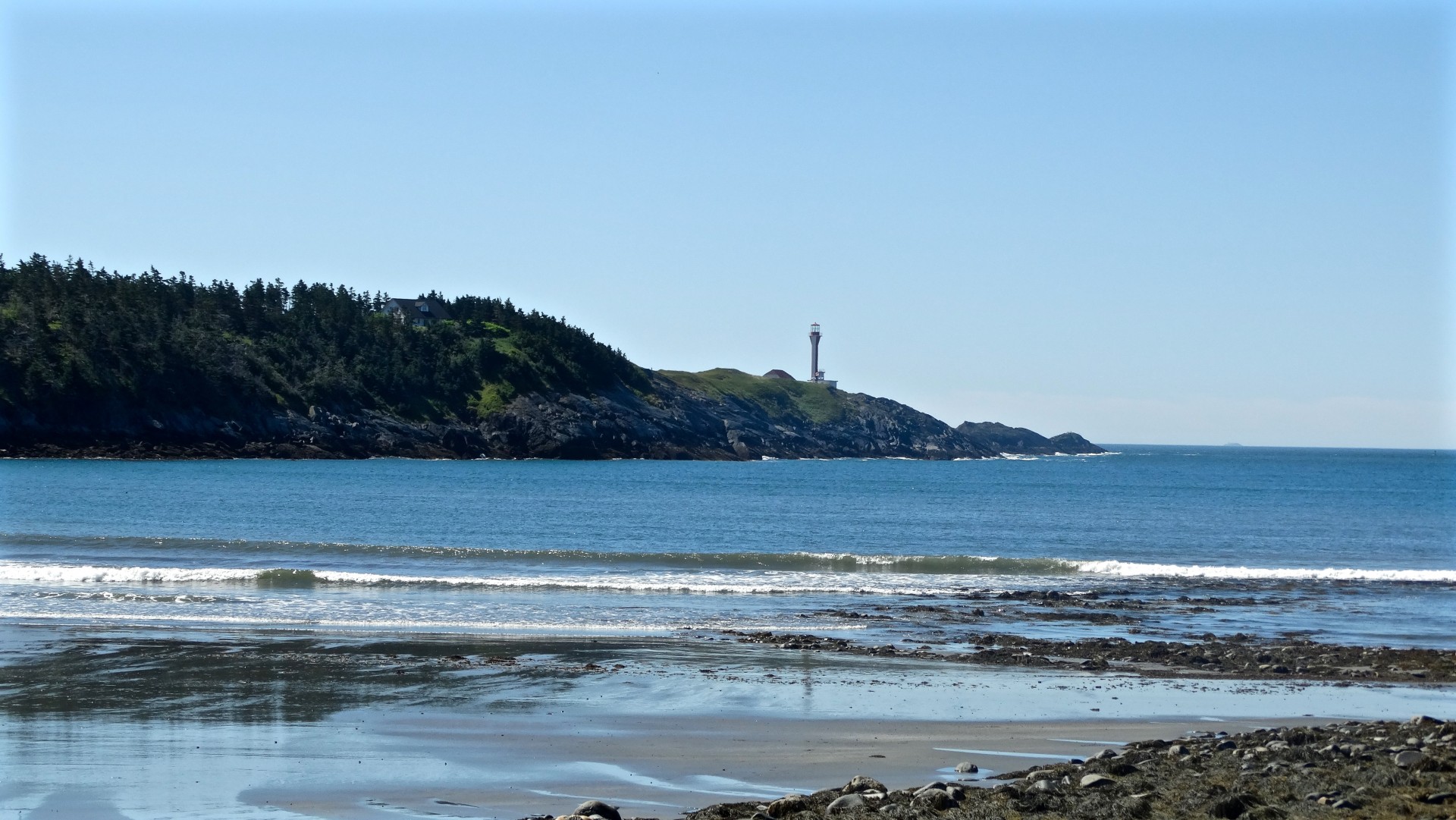 beach lighthouse waves free photo