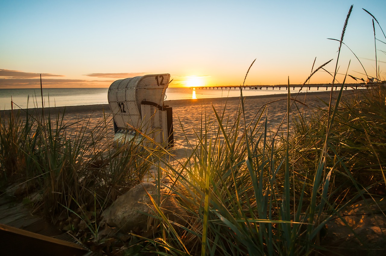 beach chair  sunrise  beach free photo