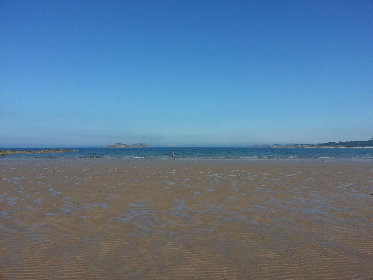 beach in scotland tide out blue sky free photo