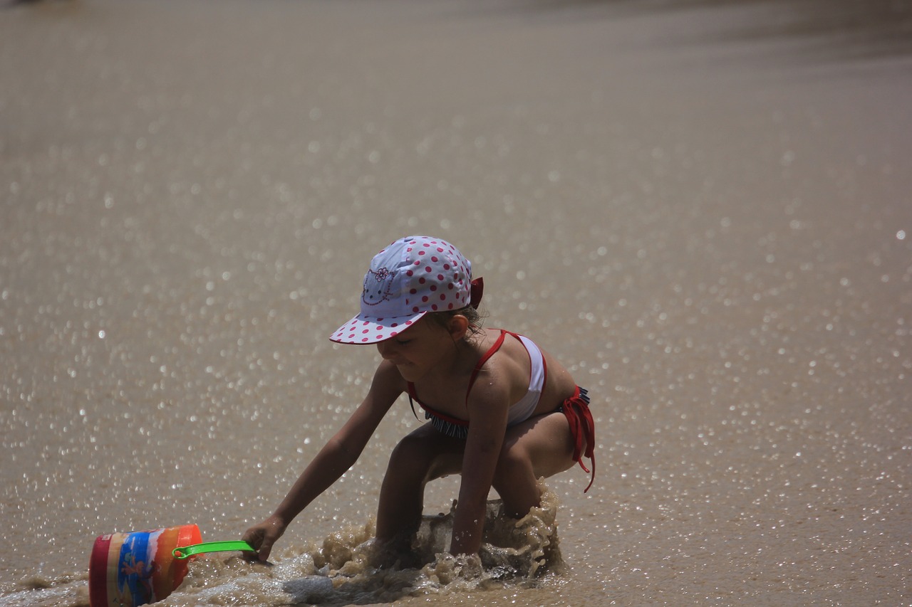 beach kids playing children the little girl free photo