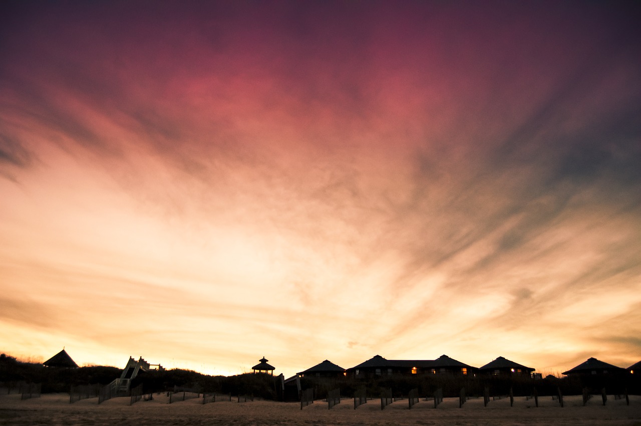 beach sky and houses impressive sky sunset sky free photo