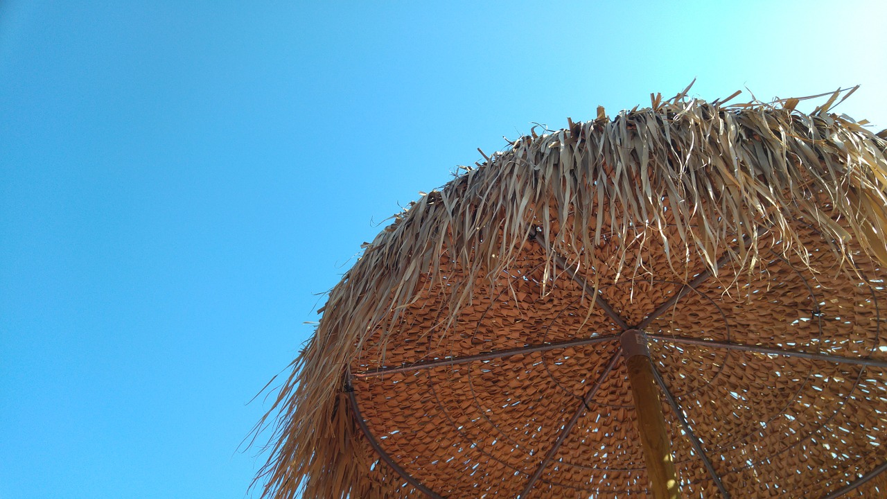 beach umbrella beach sky free photo