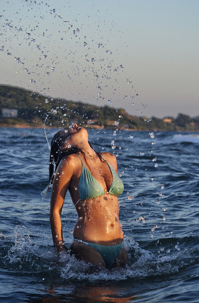 beautiful woman body sea water splash water free photo