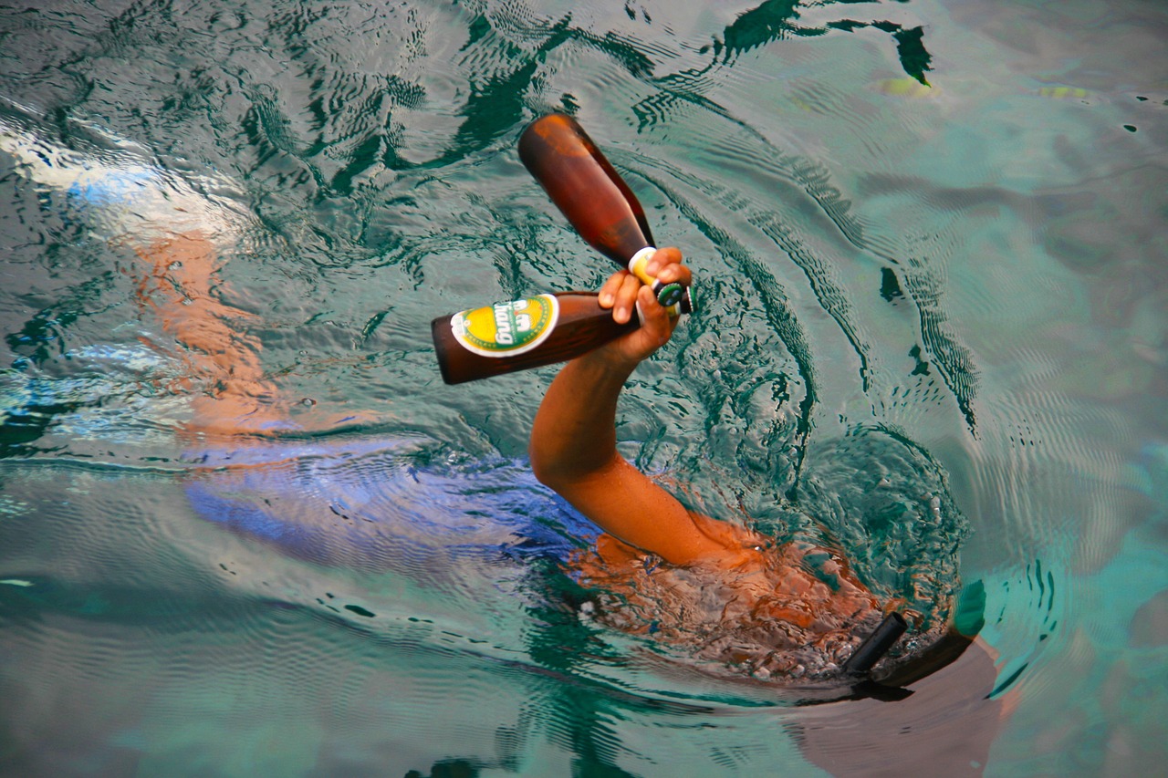 beer swimming ocean free photo