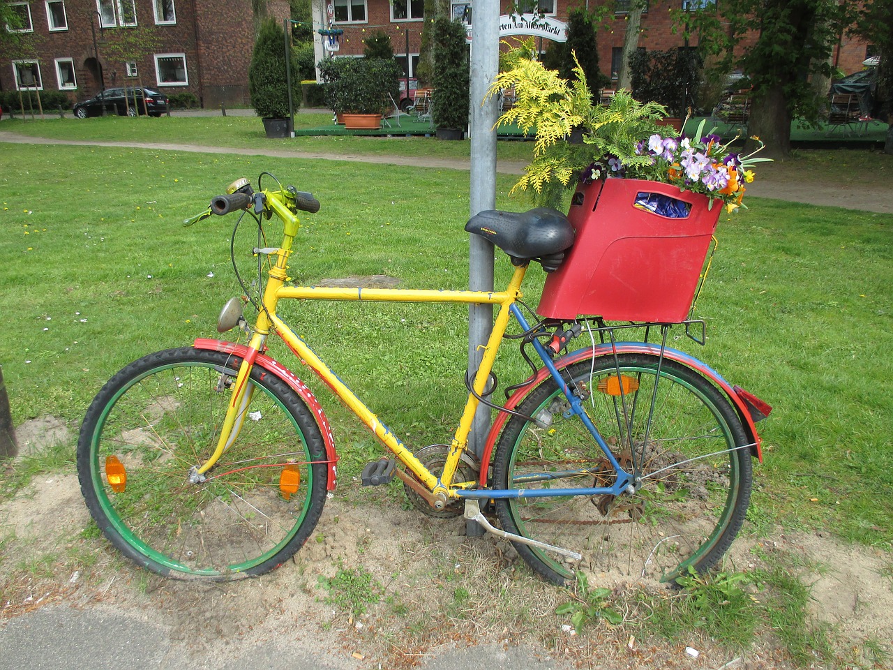 bike flowers flower bed free photo