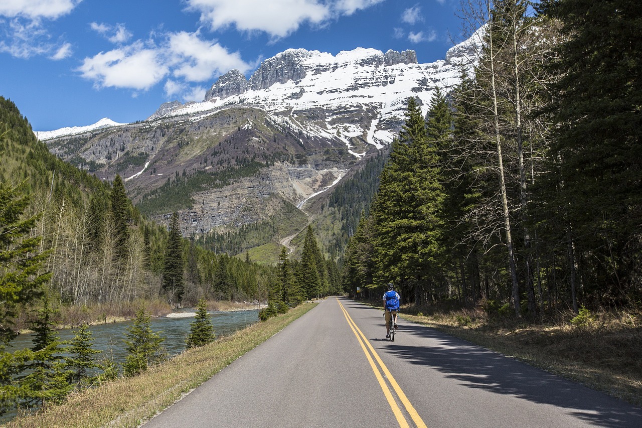 biking highway glacier national park free photo