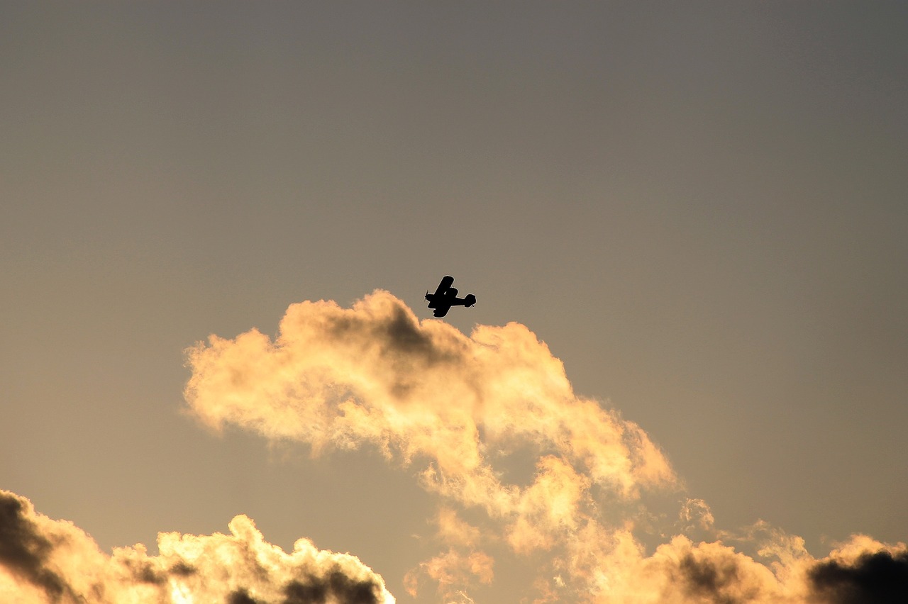 biplane flying silhouette free photo