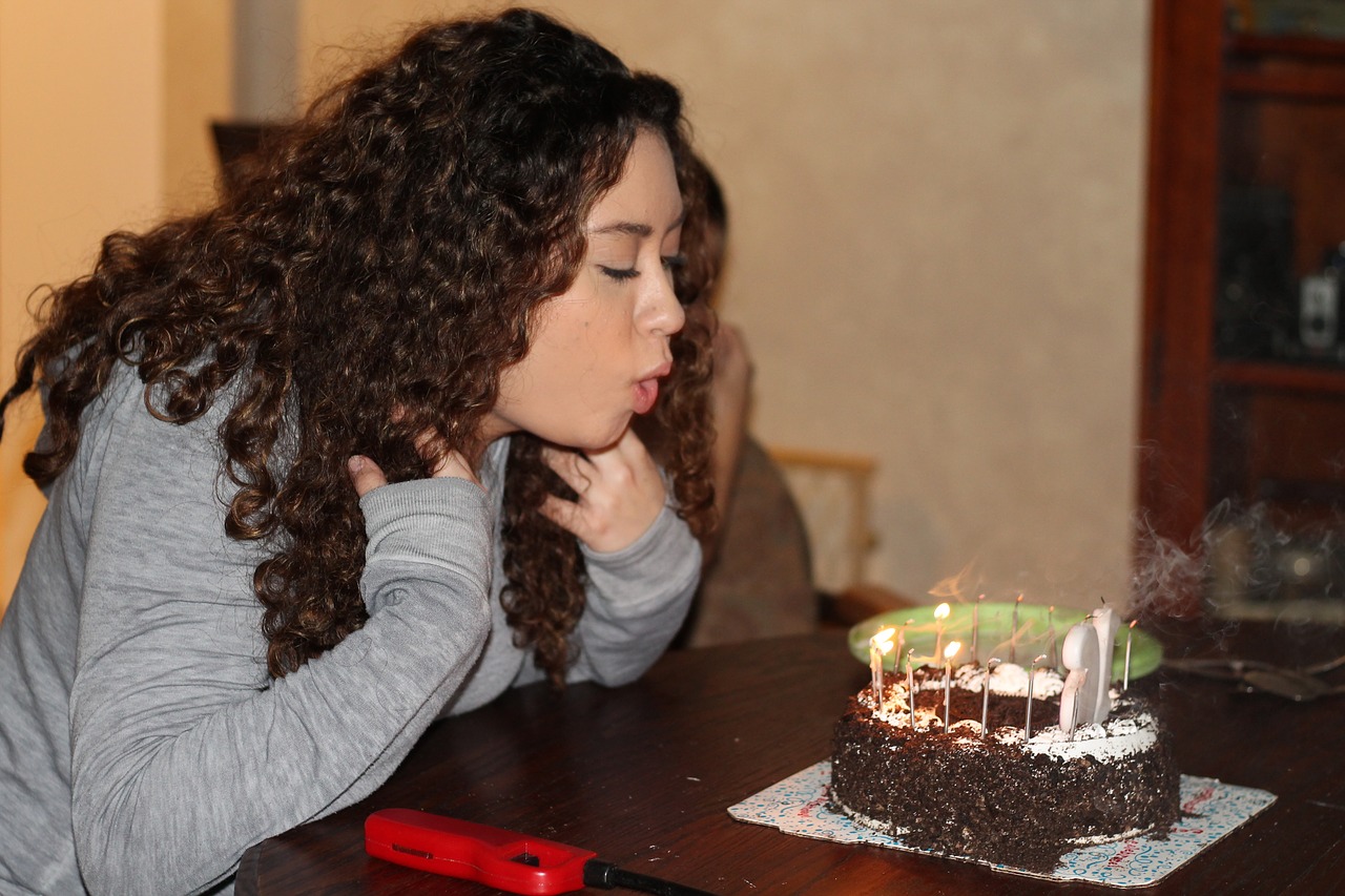 birthday blowing out candles cake free photo