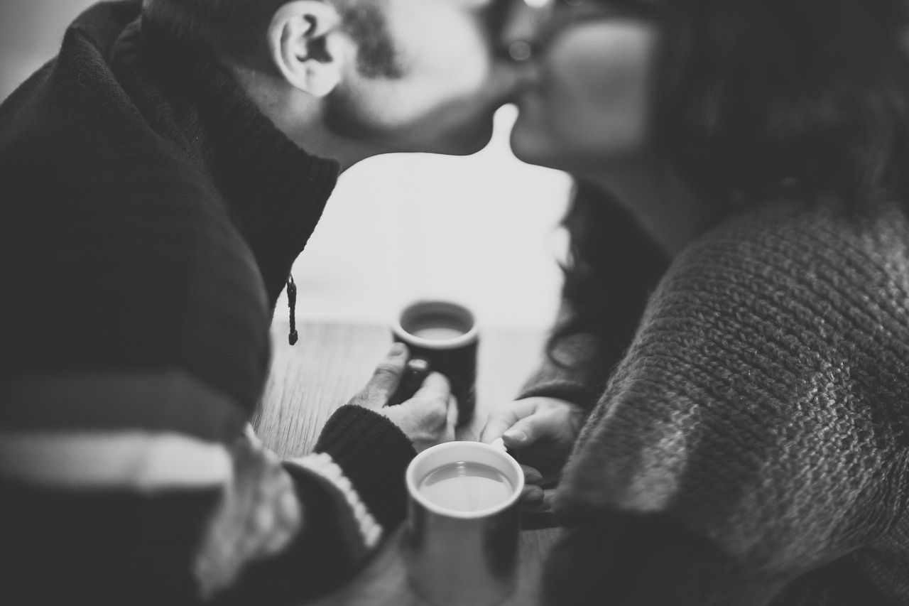 black and white couple kissing free photo