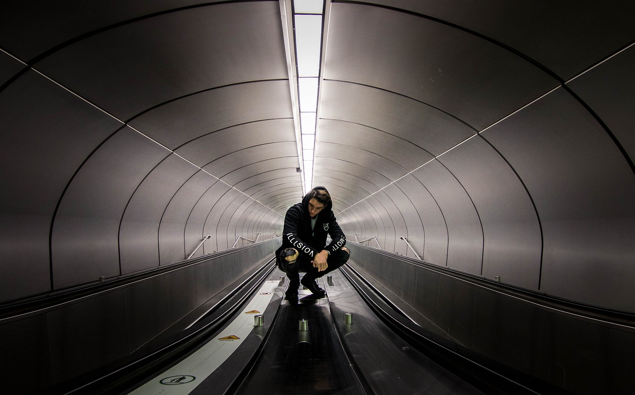 black and white tunnel people free photo