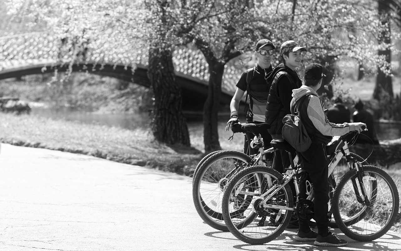 black and white  cyclists  young people free photo