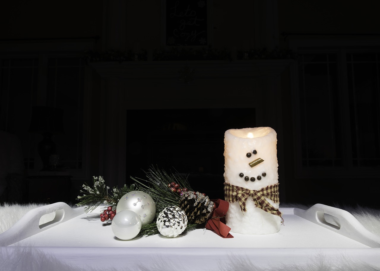 black background  snowman  candle free photo