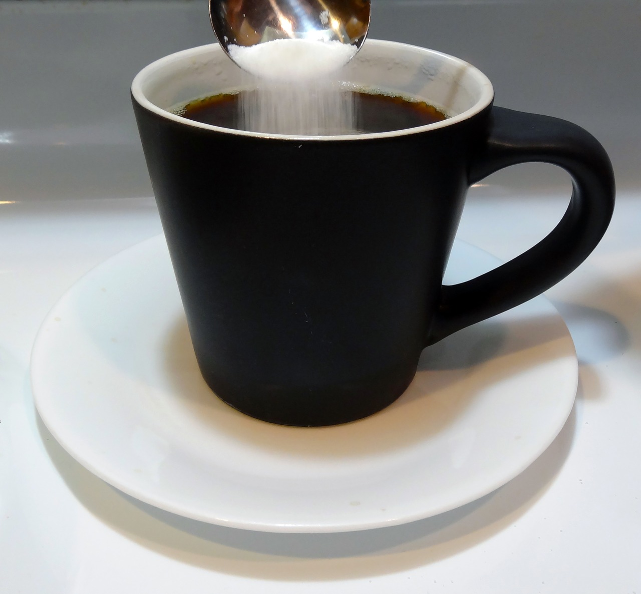 black coffee cup coffee sugar and spoon free photo