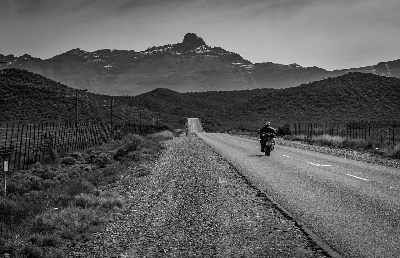 black white  road  motorcyclist free photo