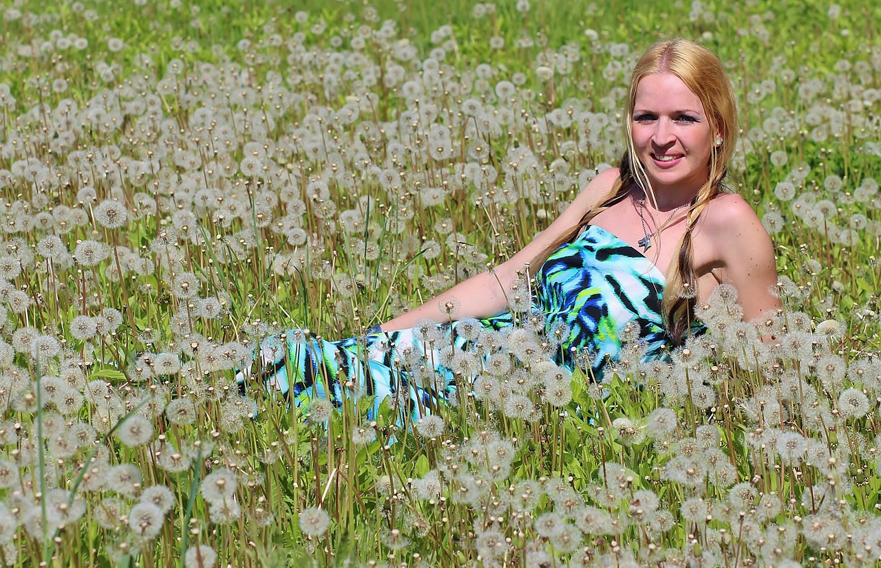 blonde woman dandelion field free photo