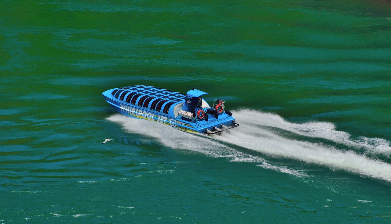 blue jet boat speeding niagara river free photo