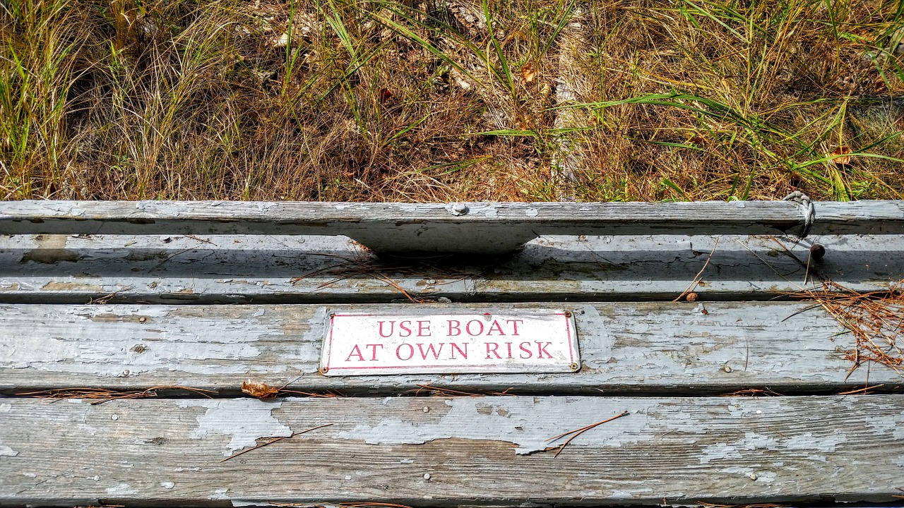 boat sign use at own risk free photo