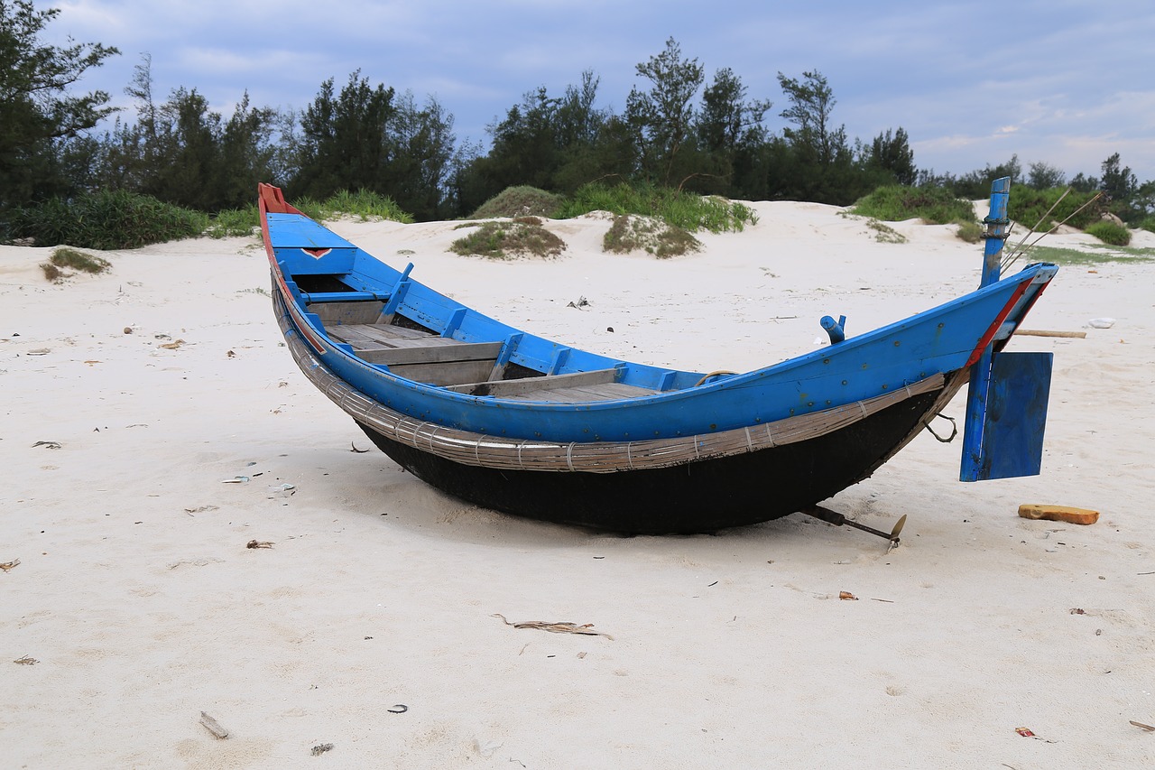 boat sand beach free photo