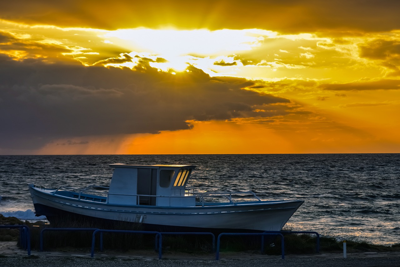 boat  sunset  sea free photo