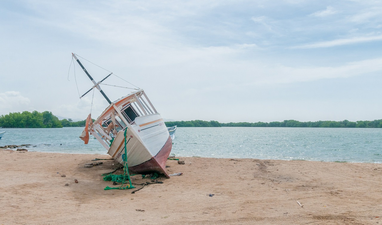 boat beached wreck free photo