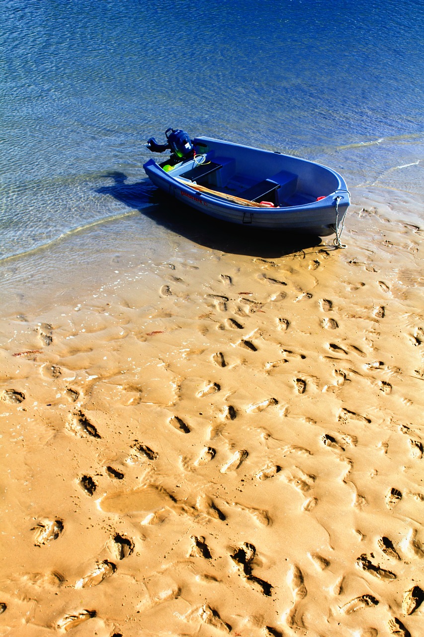 boat sand foot prints free photo
