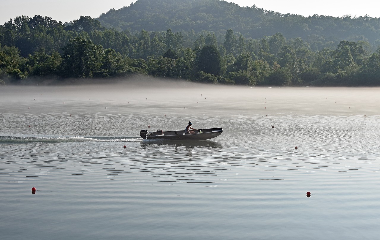 boater in fog early morning dawn free photo