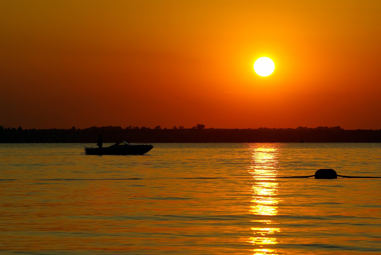 boating canton lake at sunset  lake  sunset free photo