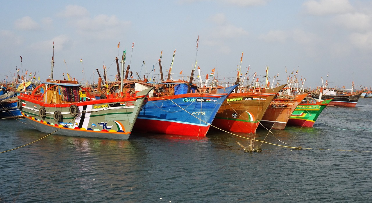 boats fishing anchored free photo