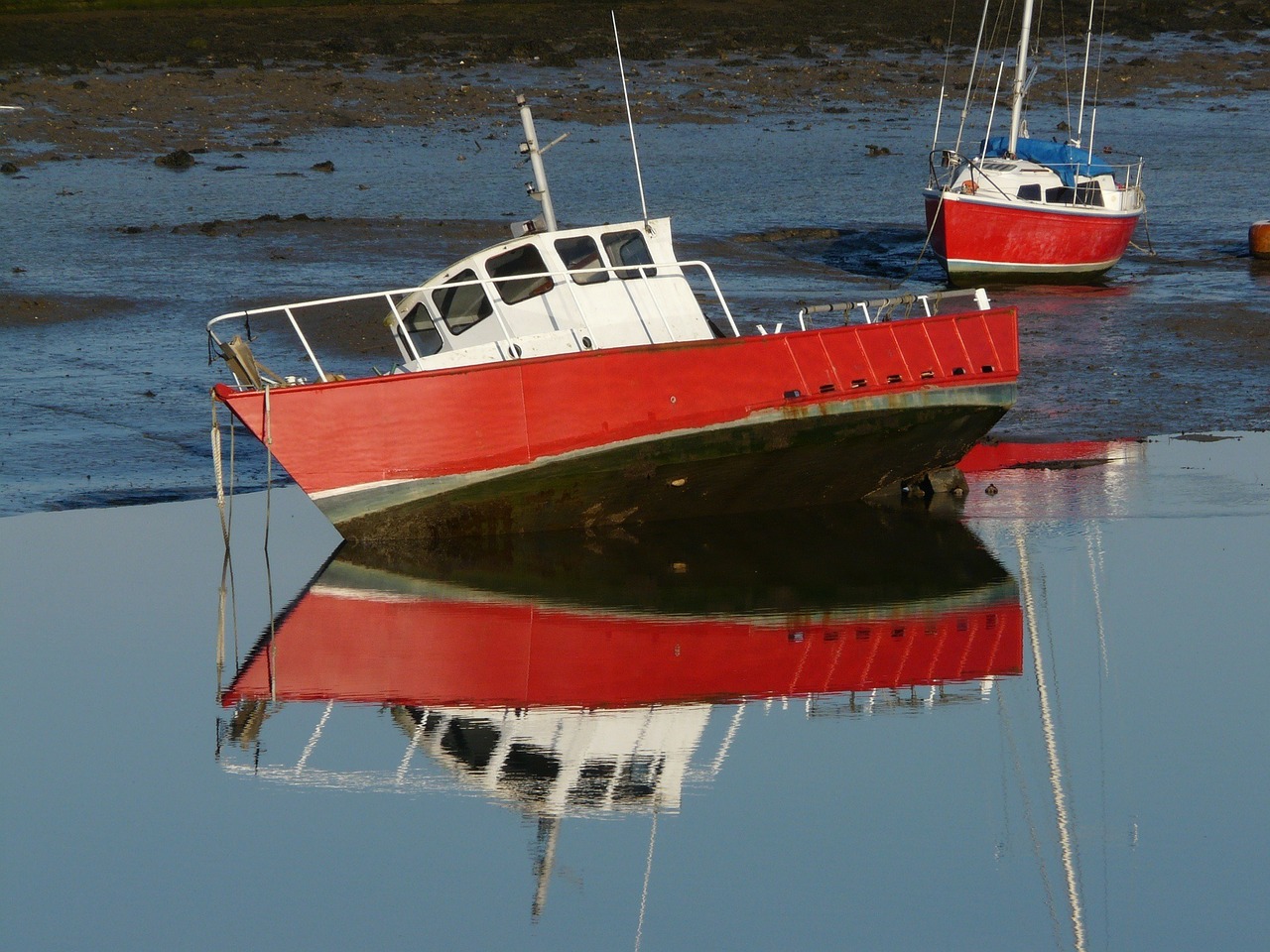 boats beached reflection free photo