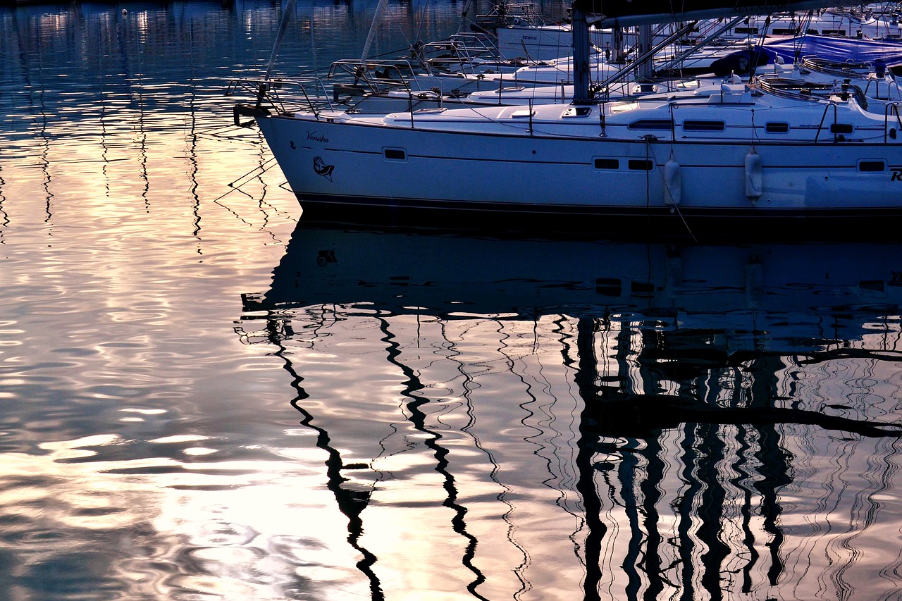 boats reflections by dawn sunset sea free photo