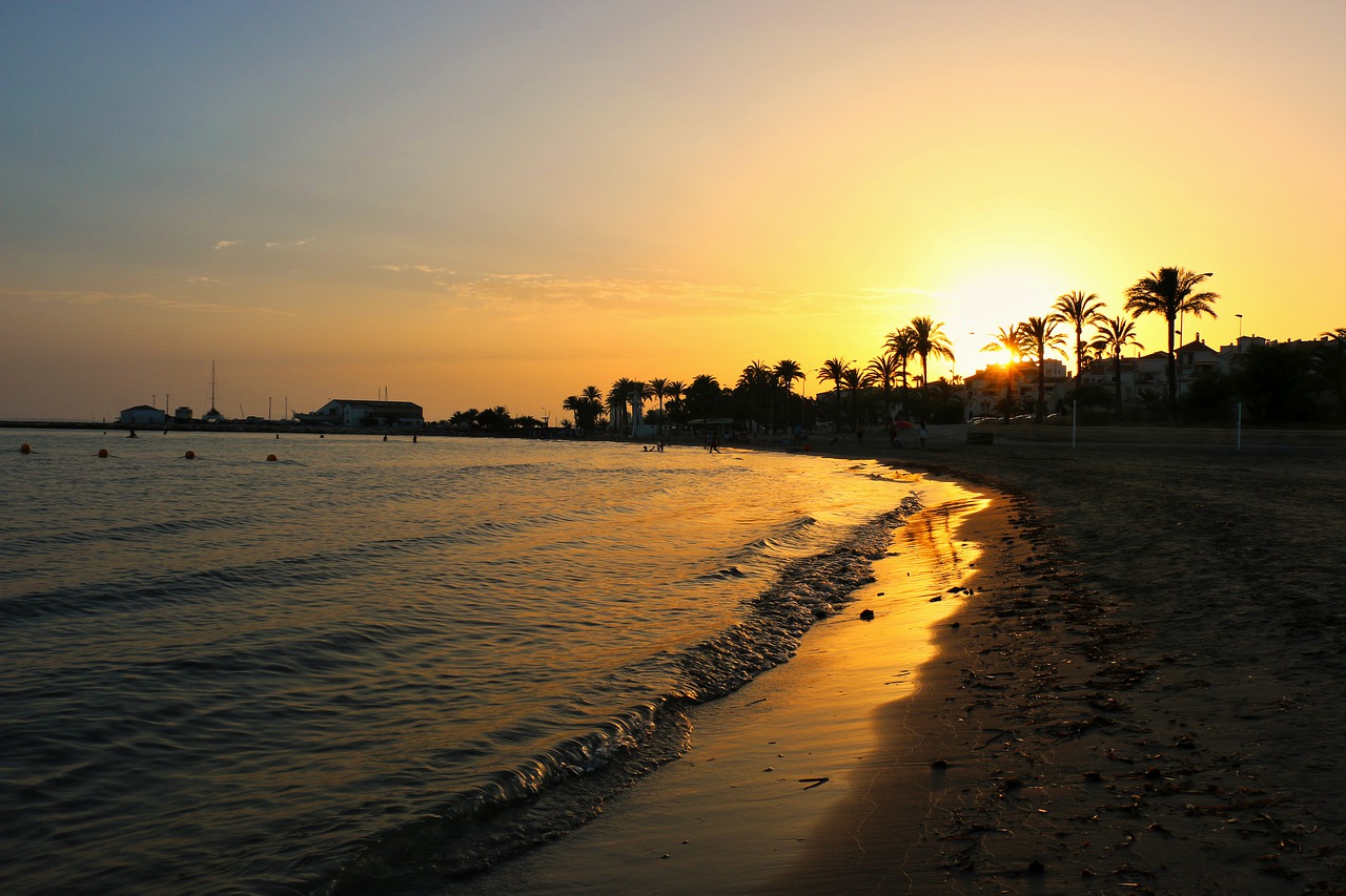 body of water sunset beach free photo