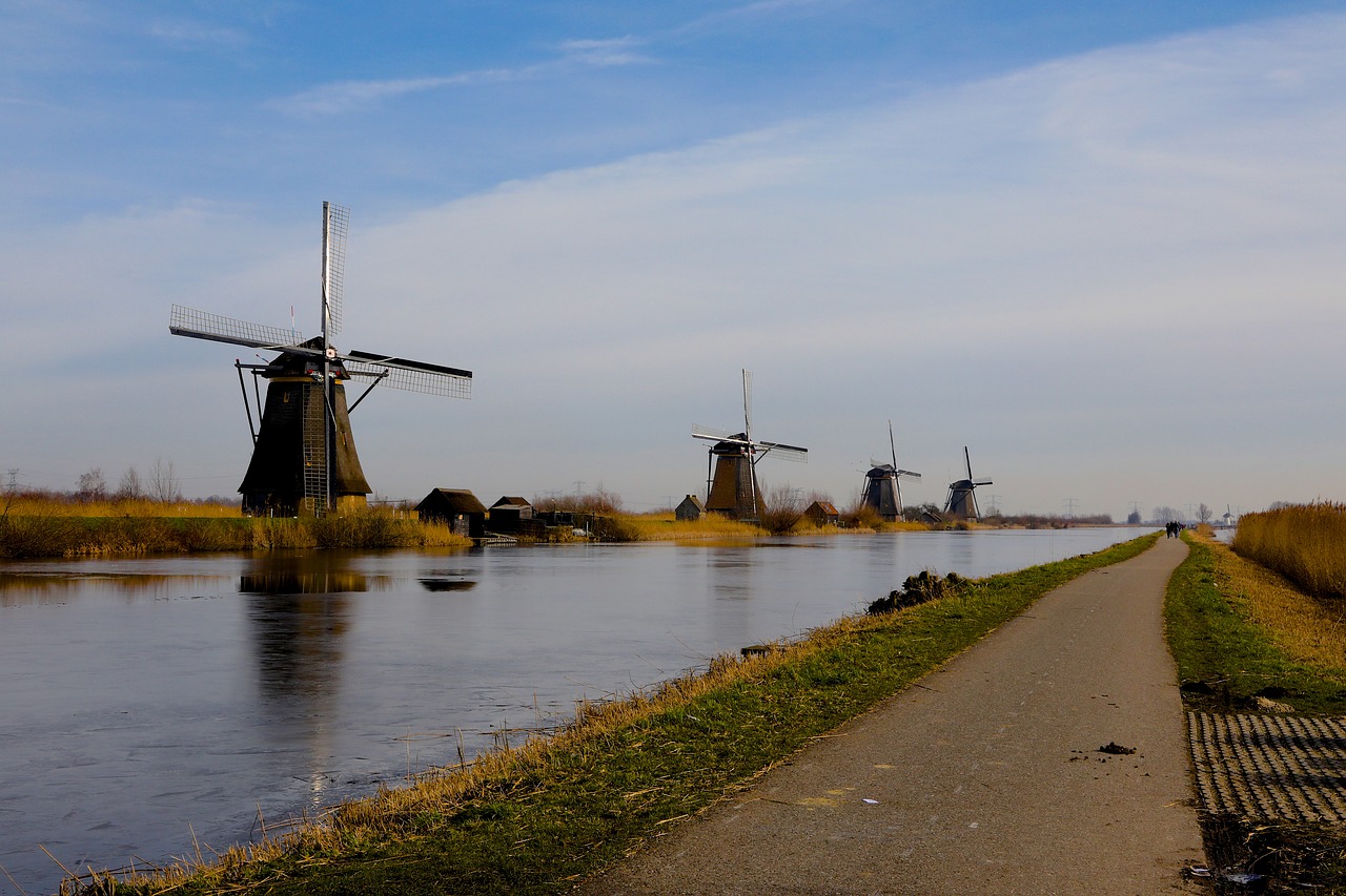 body of water wind mill river free photo