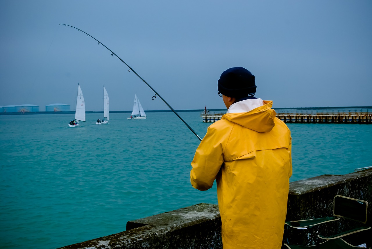 body of water sea fisherman free photo