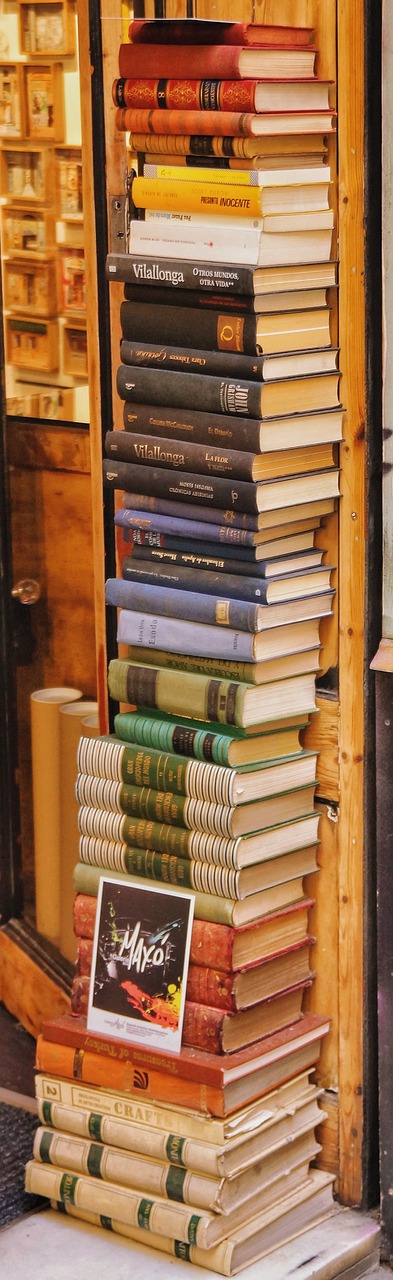 books stack outside free photo