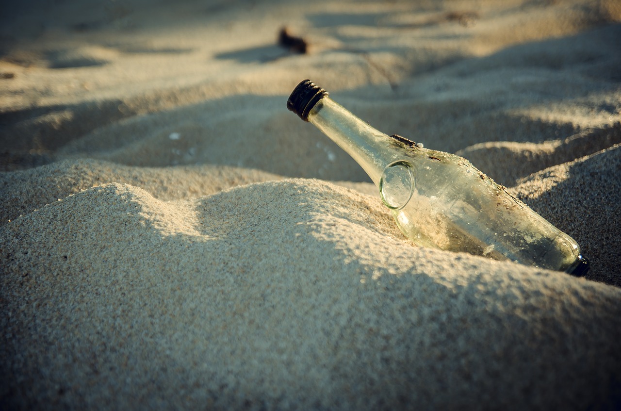bottle sand the beach free photo