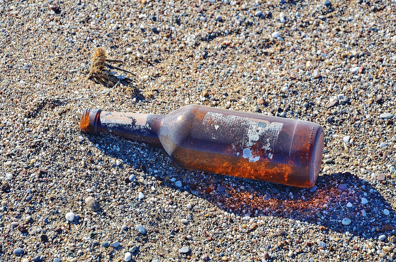 bottle sand beach free photo