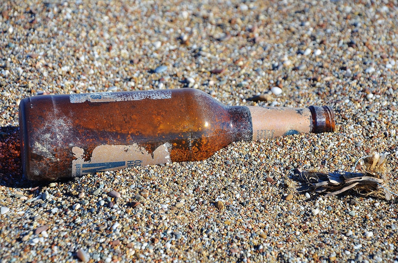 bottle sand beach free photo