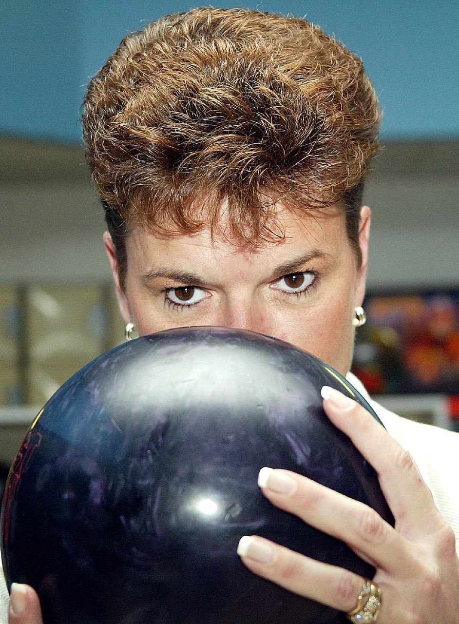 bowler concentrating woman free photo