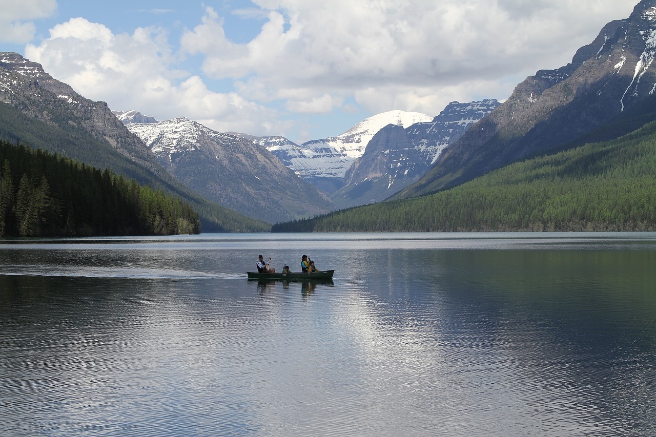 bowman lake boaters mountains free photo