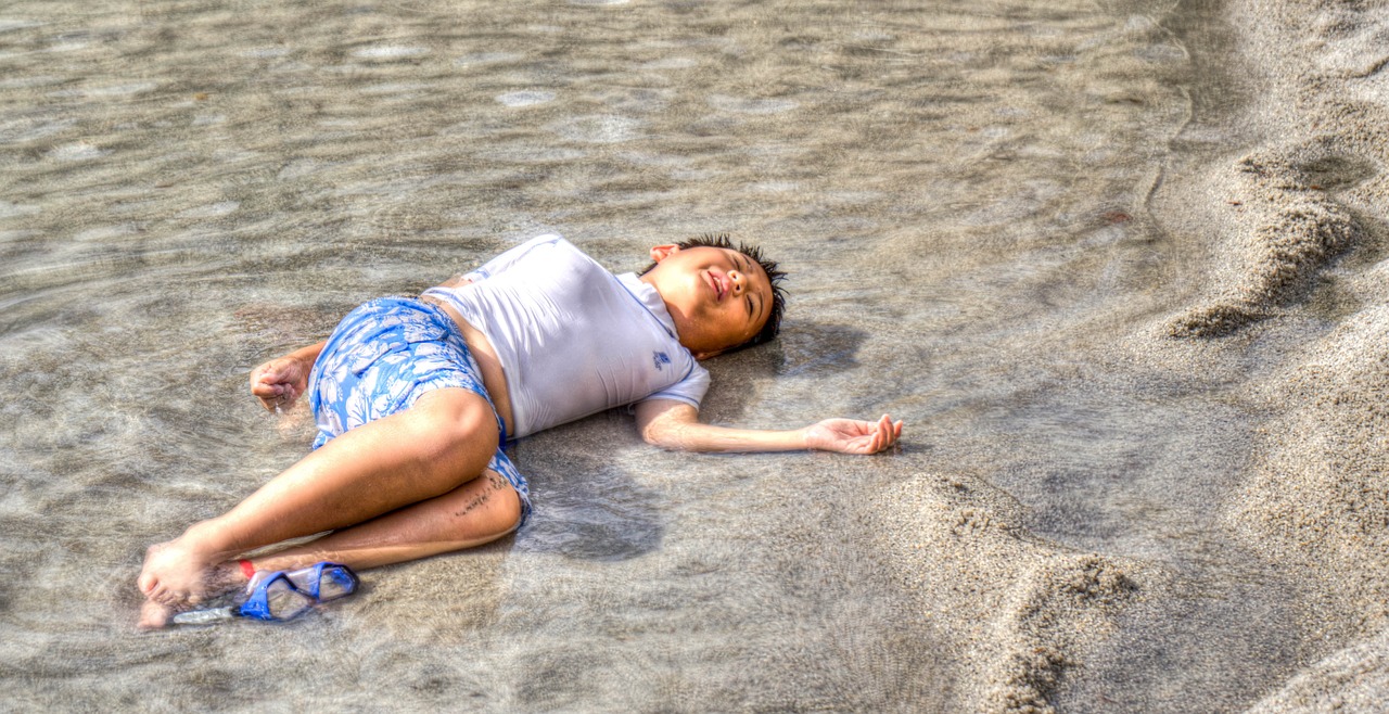 boy beach relaxing free photo