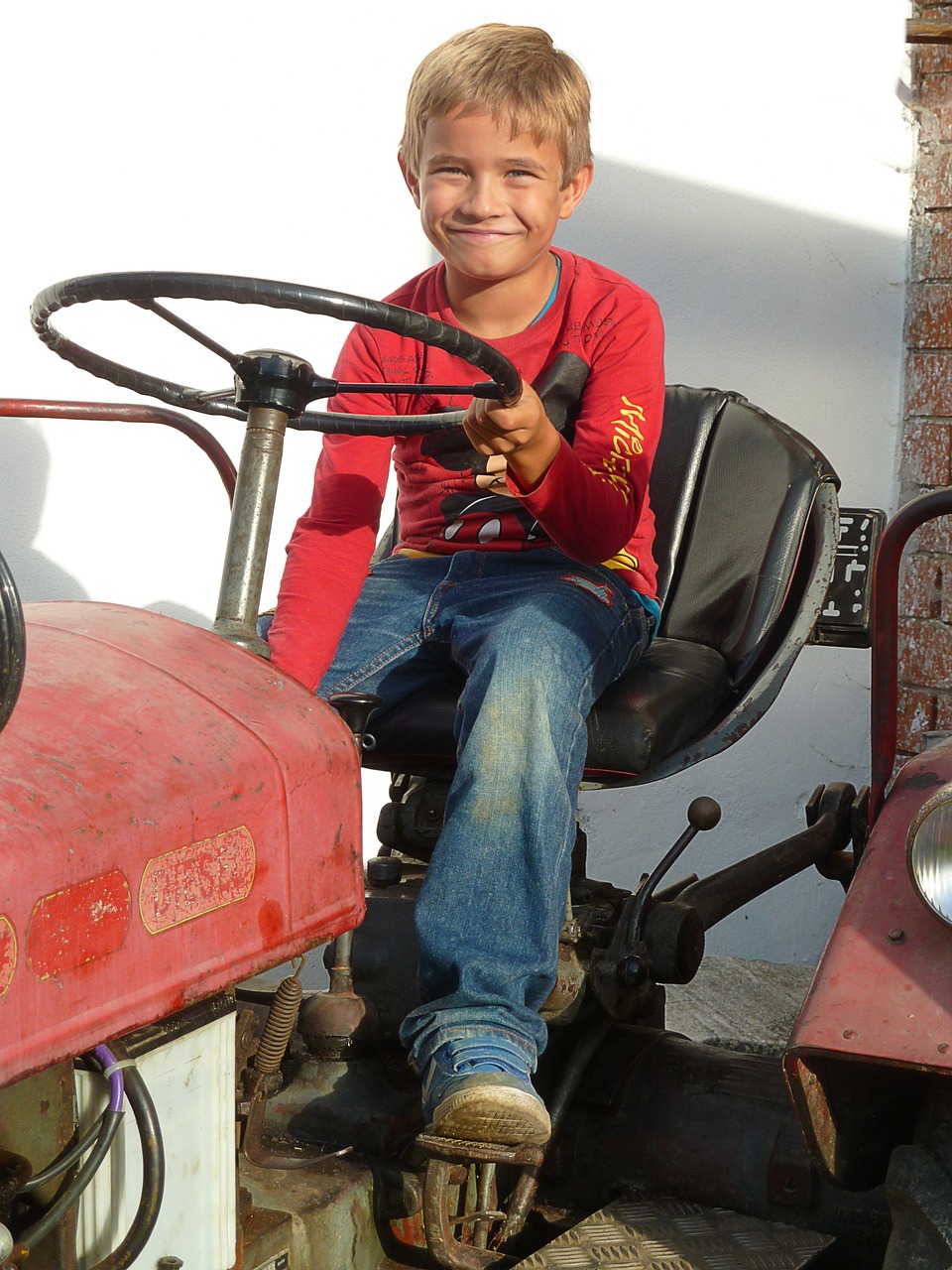 boy tractor red free photo