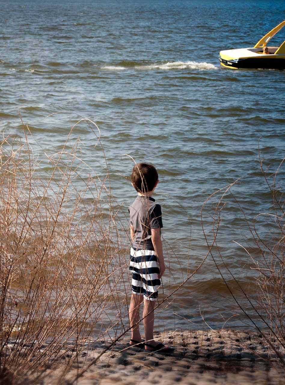 boy boat water free photo