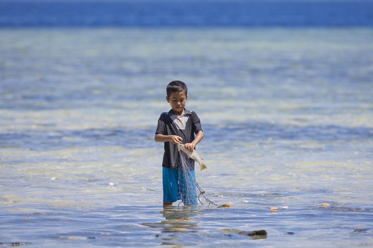 boy fishing halmahera free photo