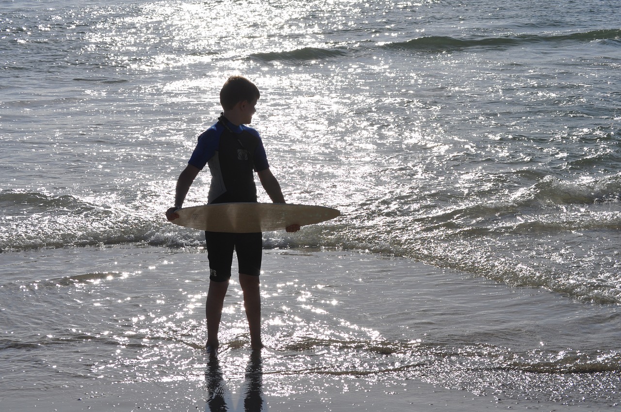 boy beach sunset free photo